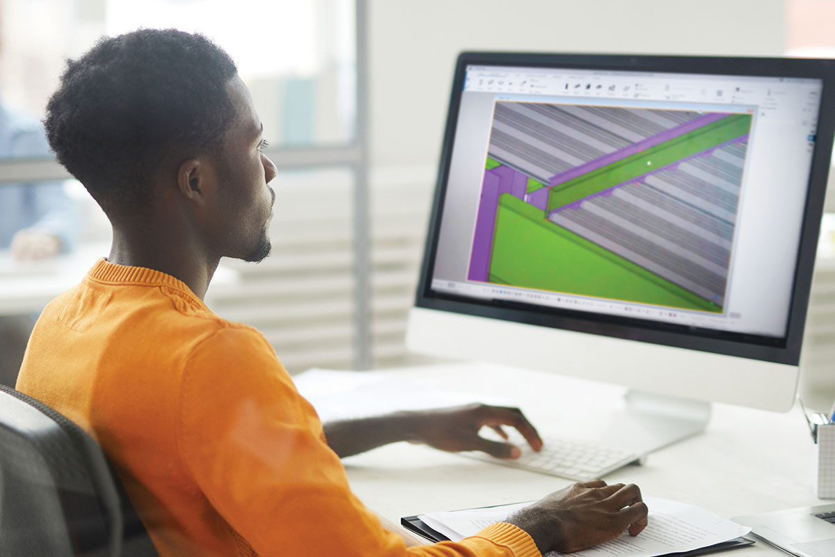 man using BIM software on a computer
